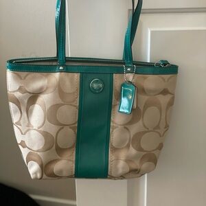Green and tan/cream Coach bag